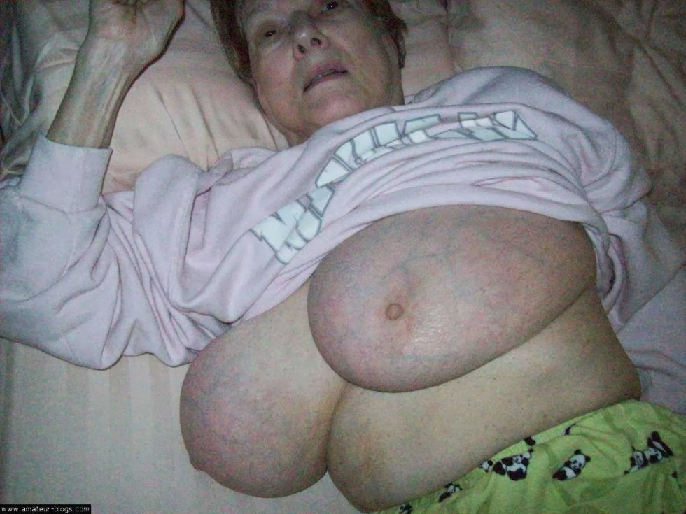 Big boobs of a sleeping grandmother