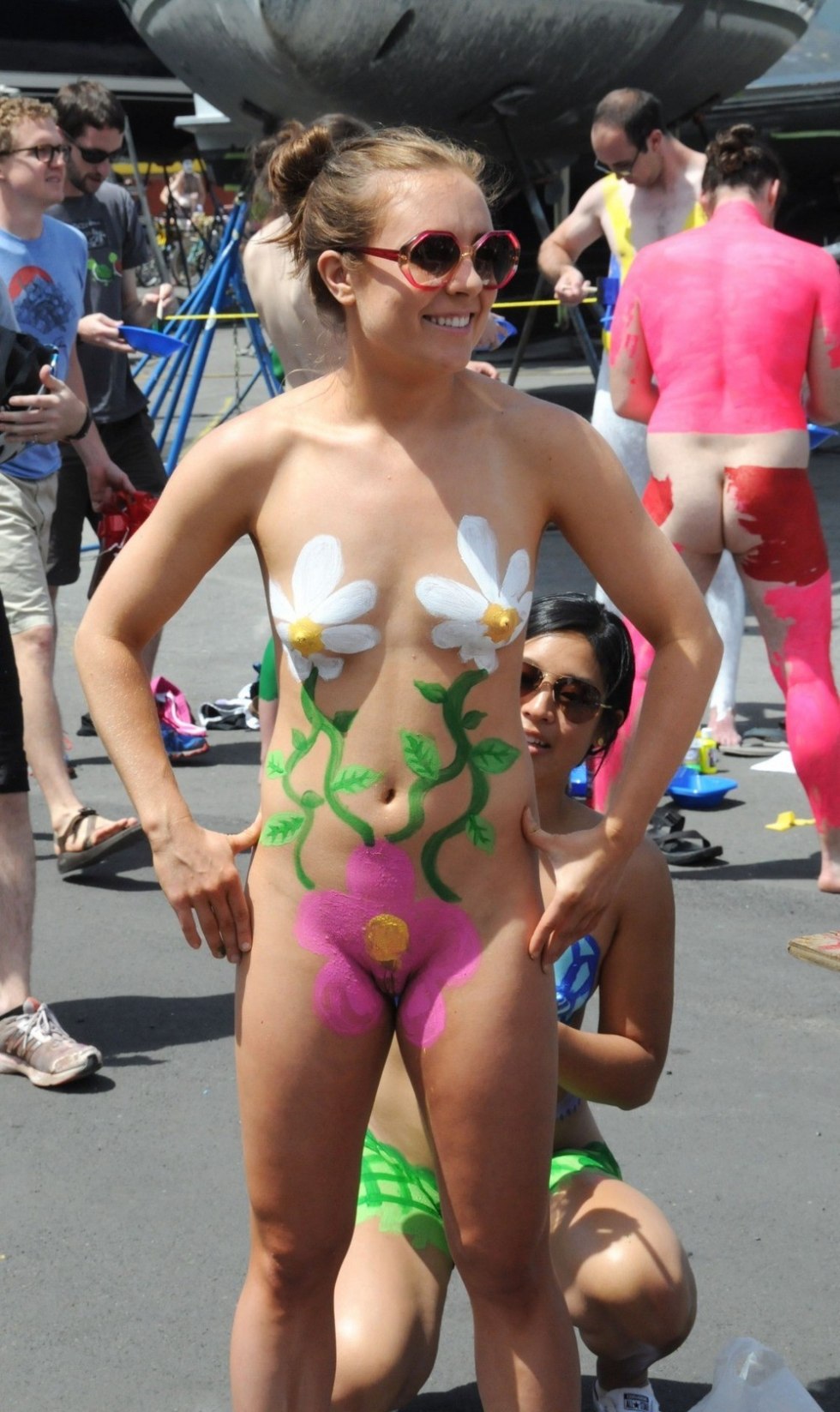 Naked women on the beach body art