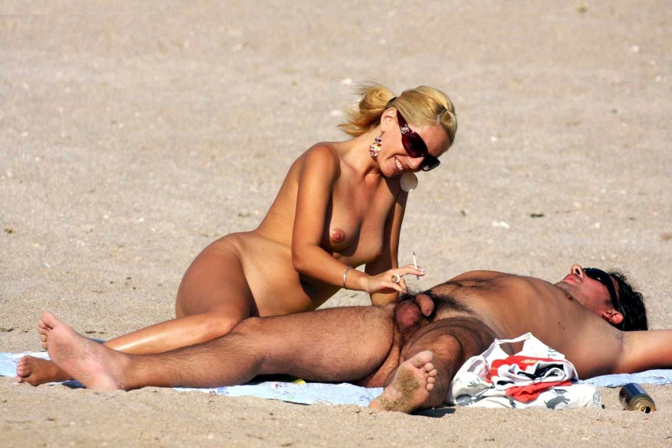 Naked men and women on the beach