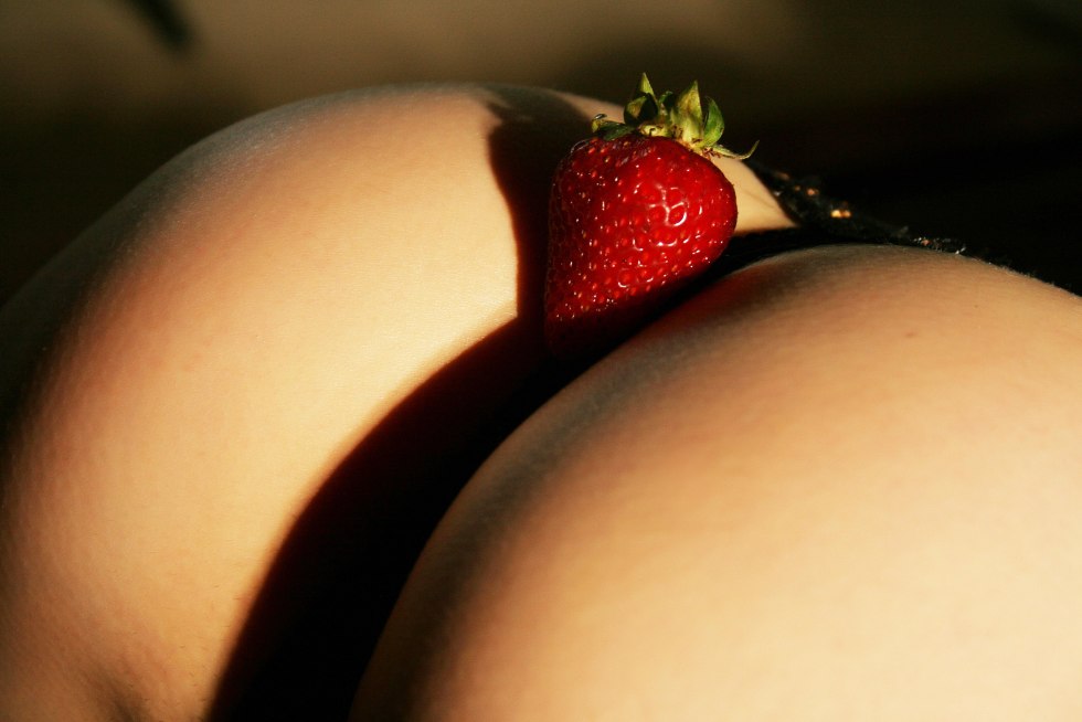 Erotic photo shoot with strawberries
