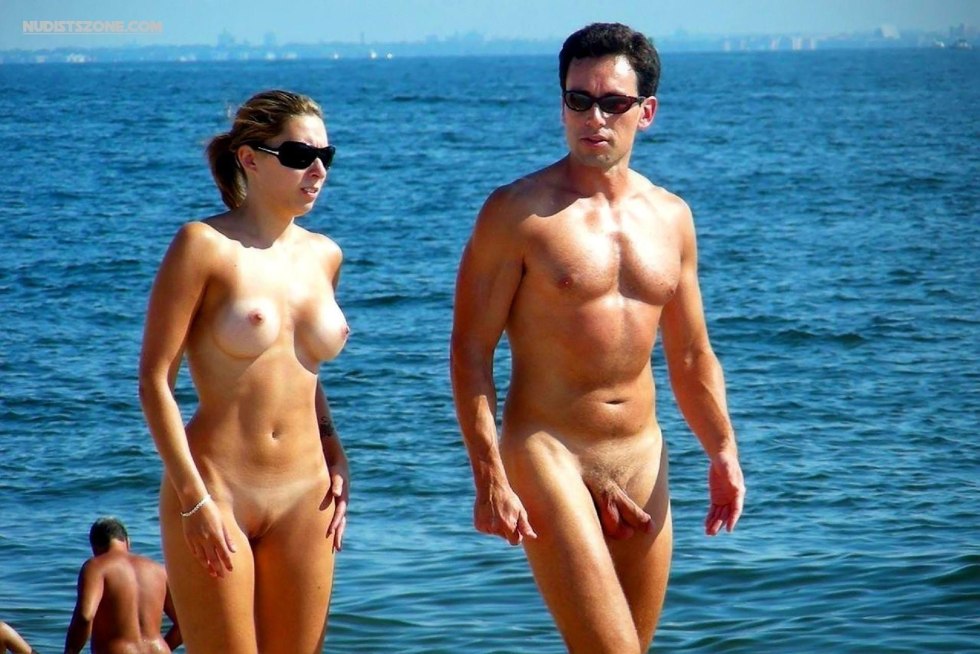 Naked men and women on the beach