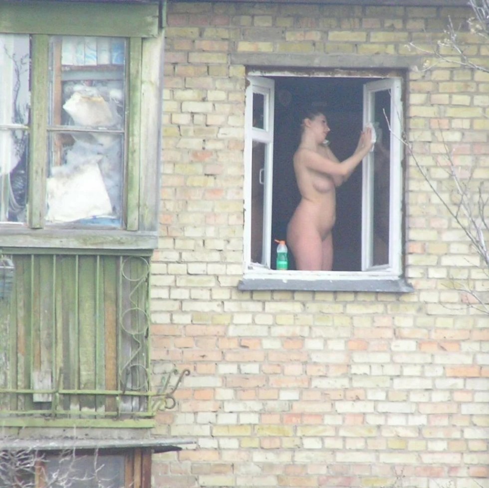 Naked in the windows of neighboring houses