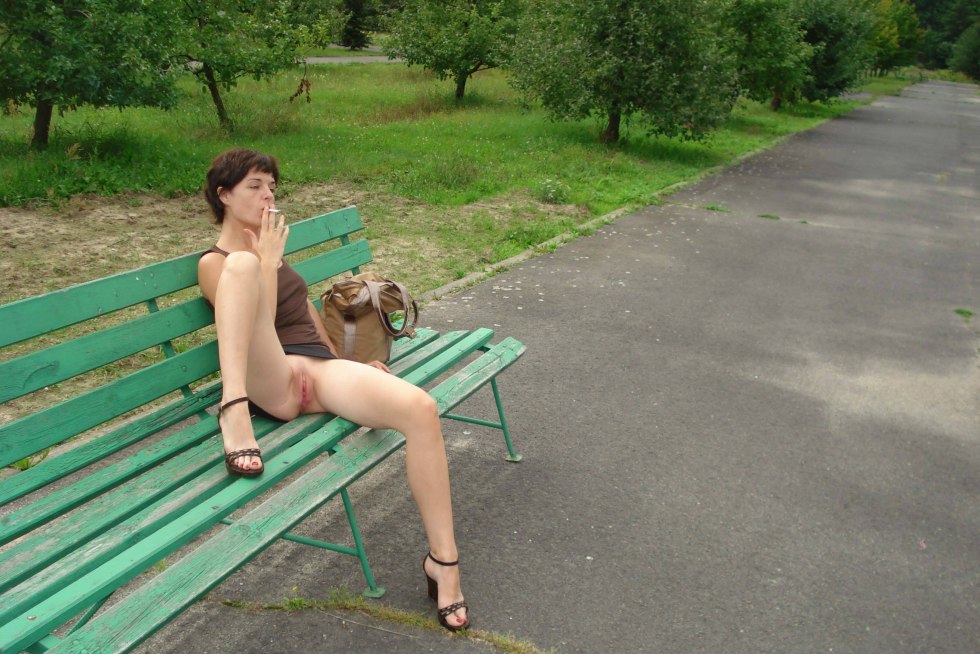 Girl walks in a park without panties