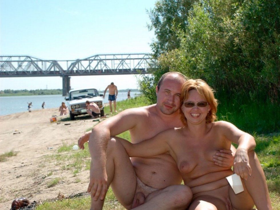 Couples on the beach without complexes