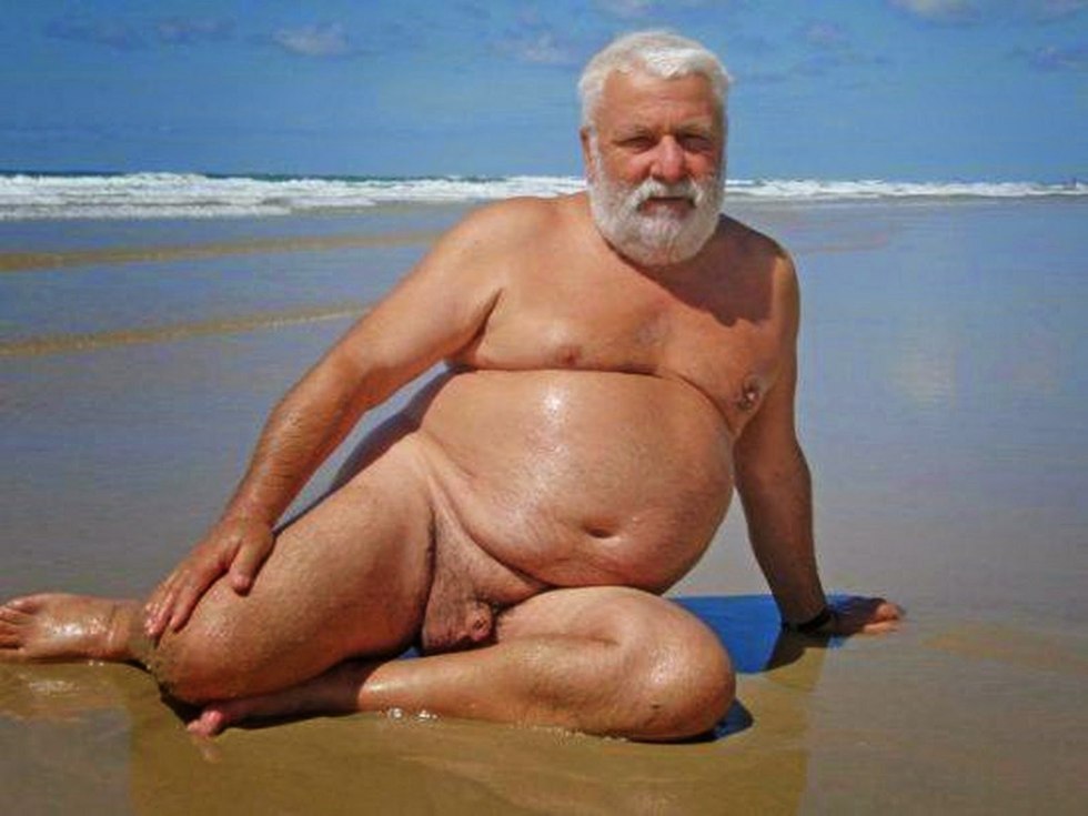 Naked fat man on the beach