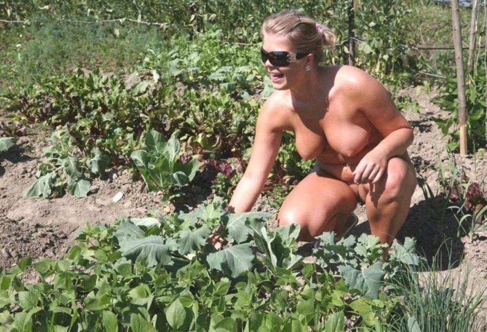 Naked wife in the country in the garden