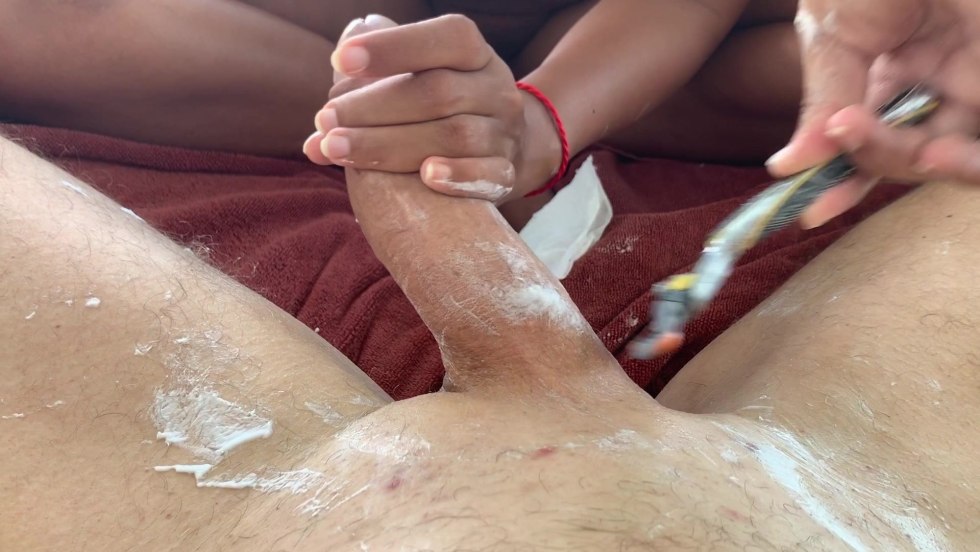 The guy shaves the girl pubis