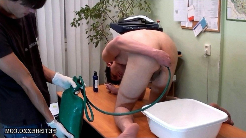 Enema in the naked ass of a guy