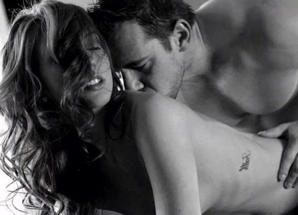 A man passionately kisses a woman