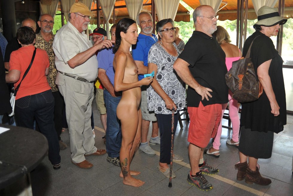 Naked among dressed at a party