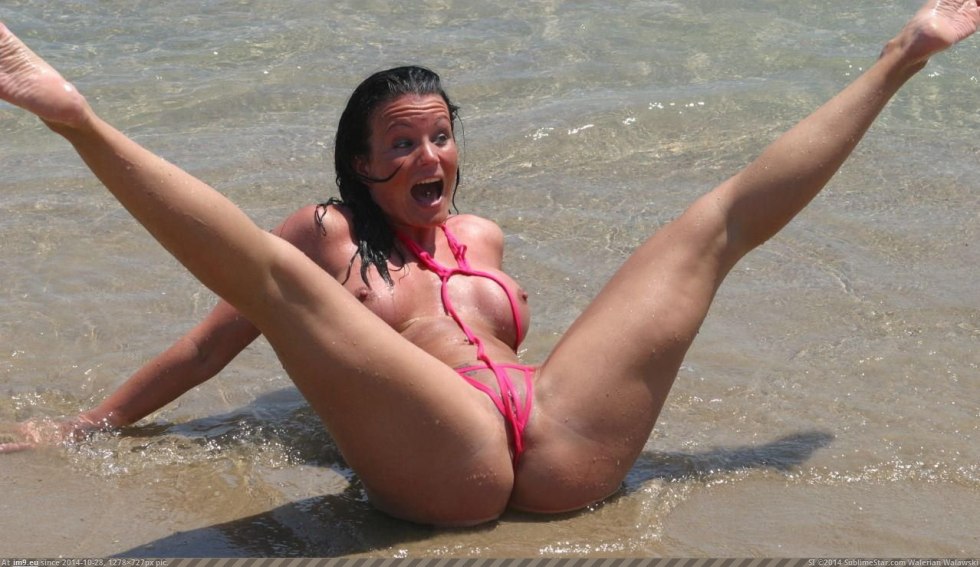 A placed legs on the beach without a bikini