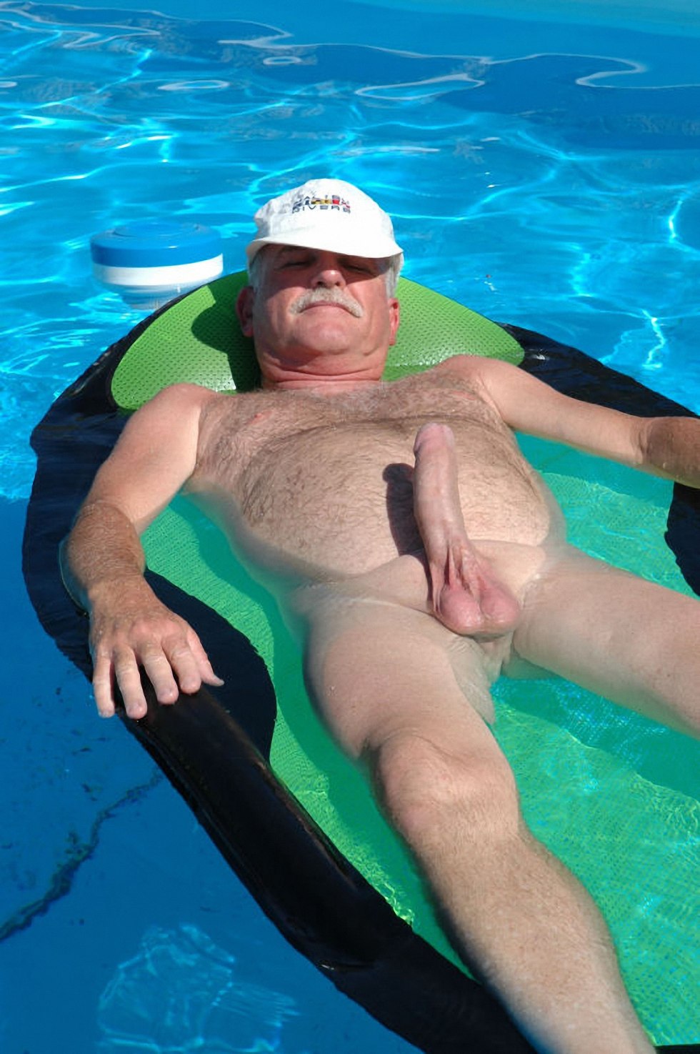 Naked men in a pool without panties