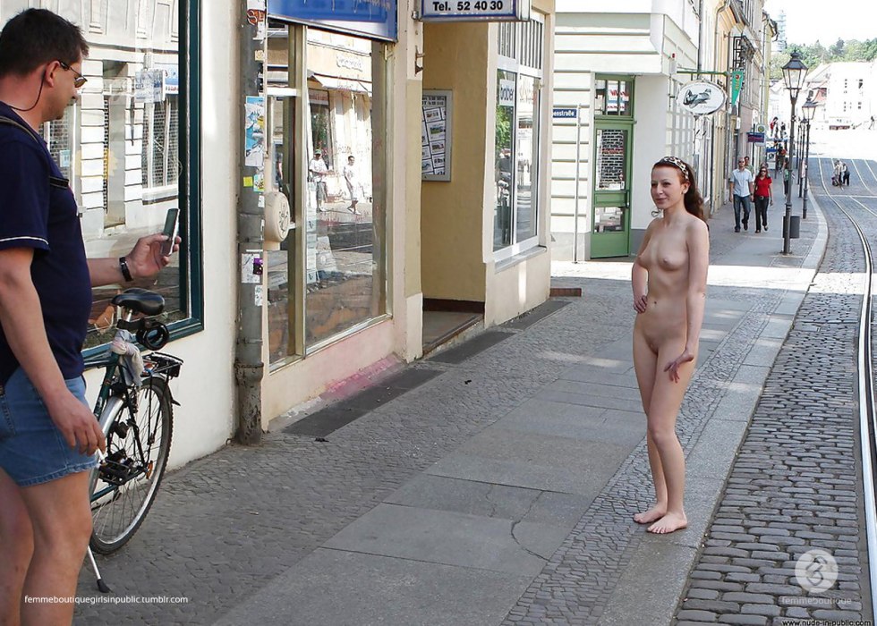 Naked girls walk along the street