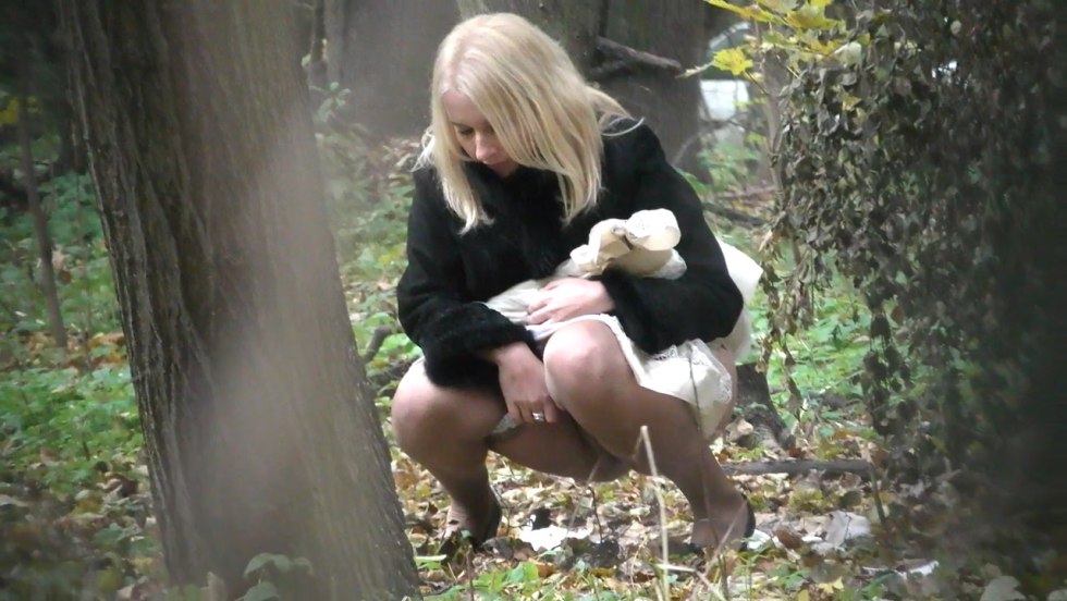 The girl crouched in the bushes