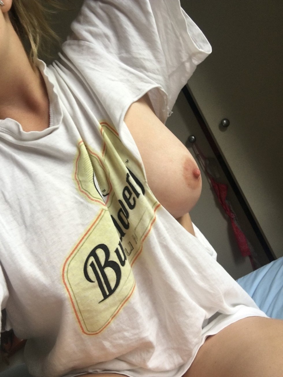 Naked chest in a torn T -shirt