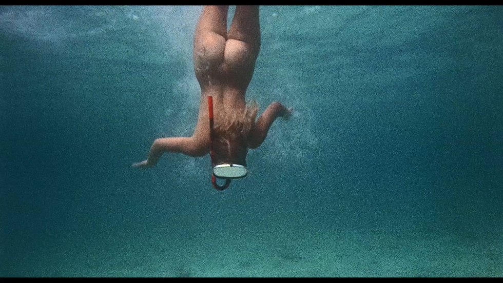 Naked women jump into the water