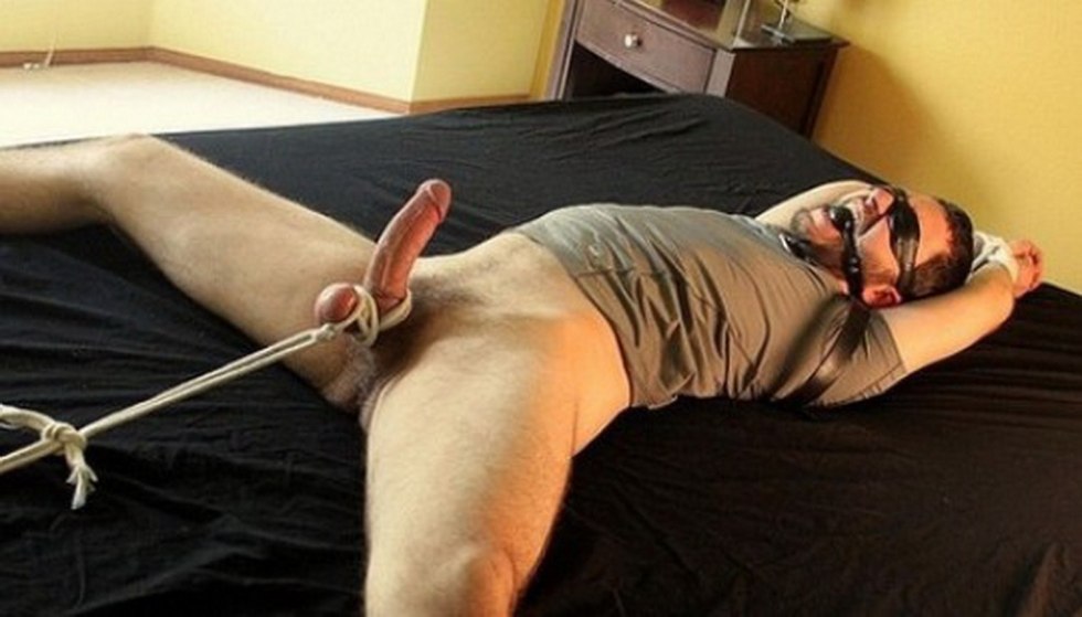 Content man on the bdsm bed