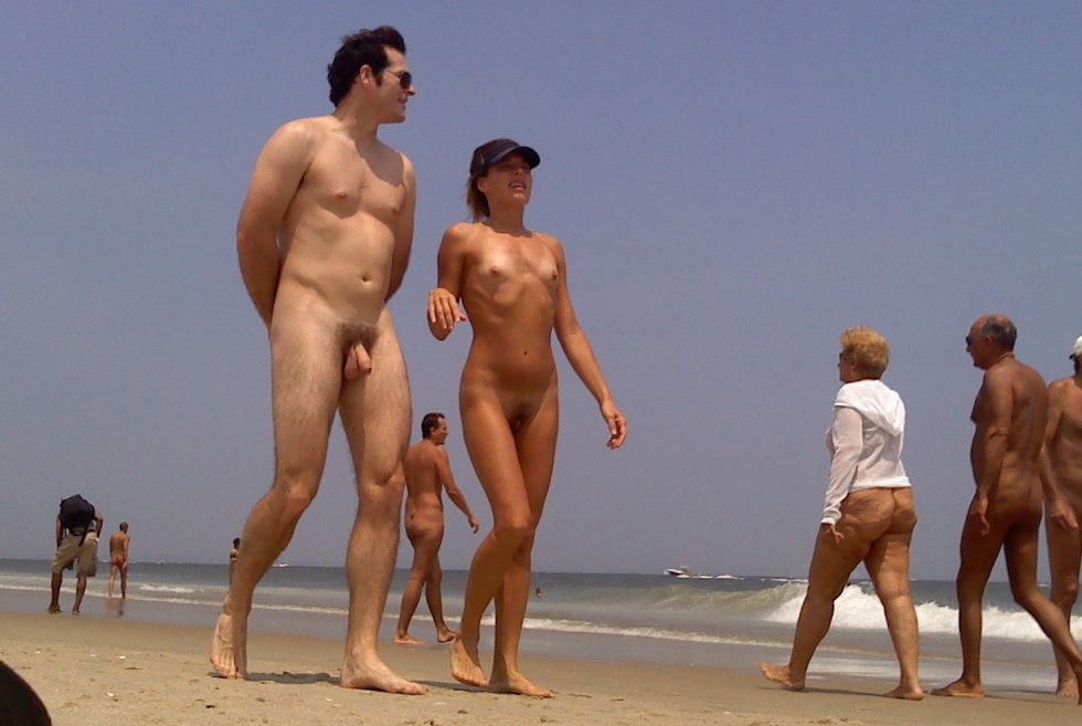 Naked guys in a belt of fidelity on the beach
