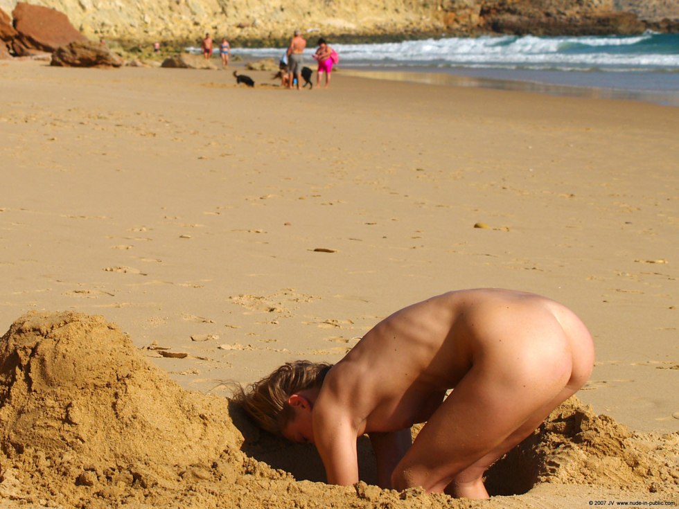 Nudist on the beach in the sand