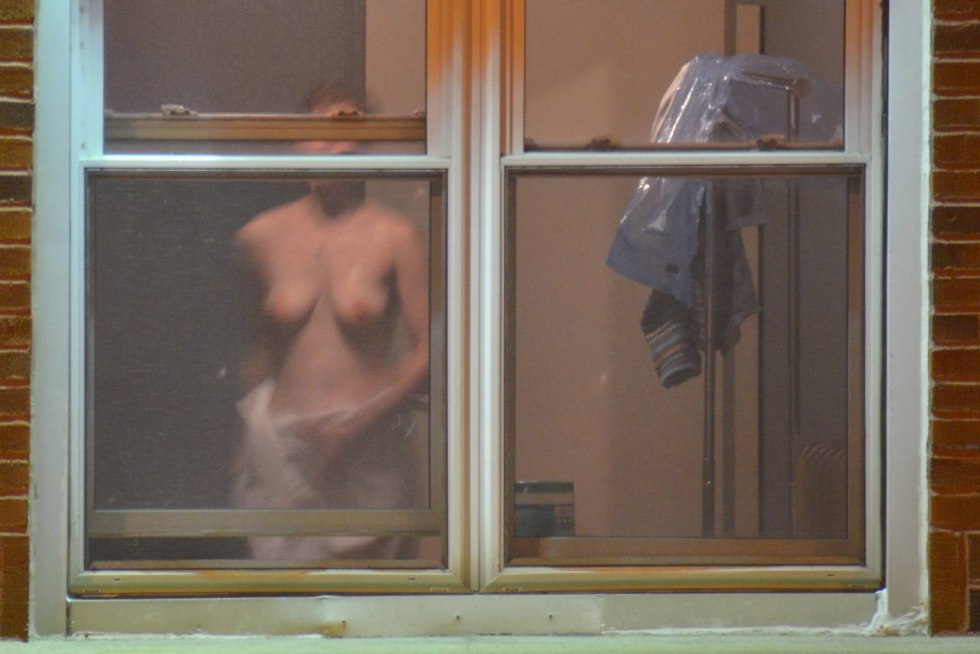 Naked women in the window is spied