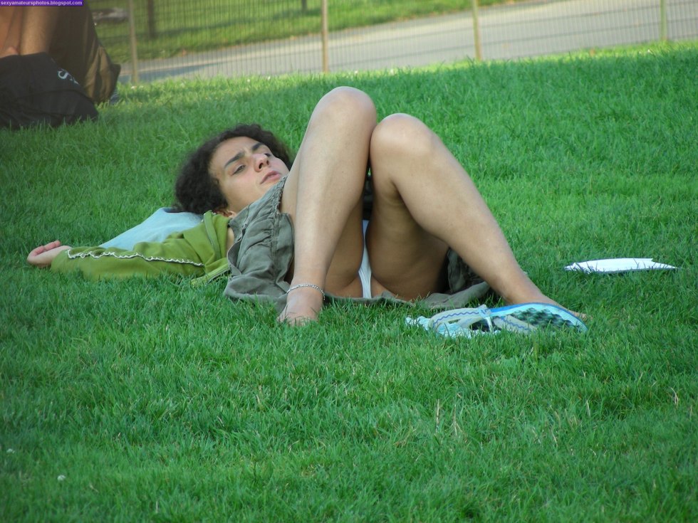 Girl on the lawn without panties
