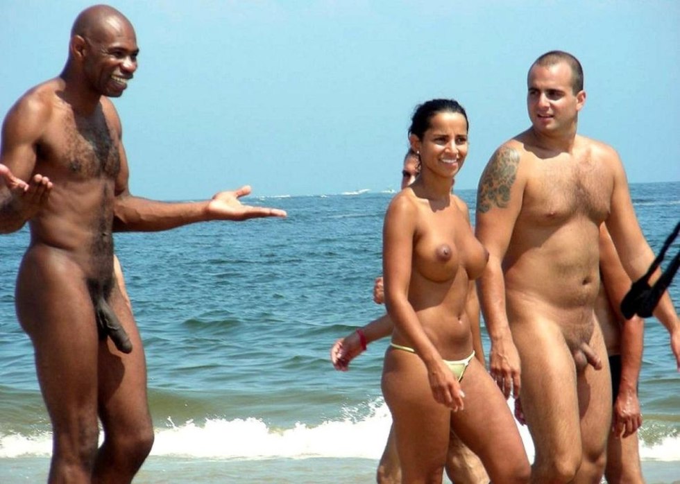 Naked men and women on the beach