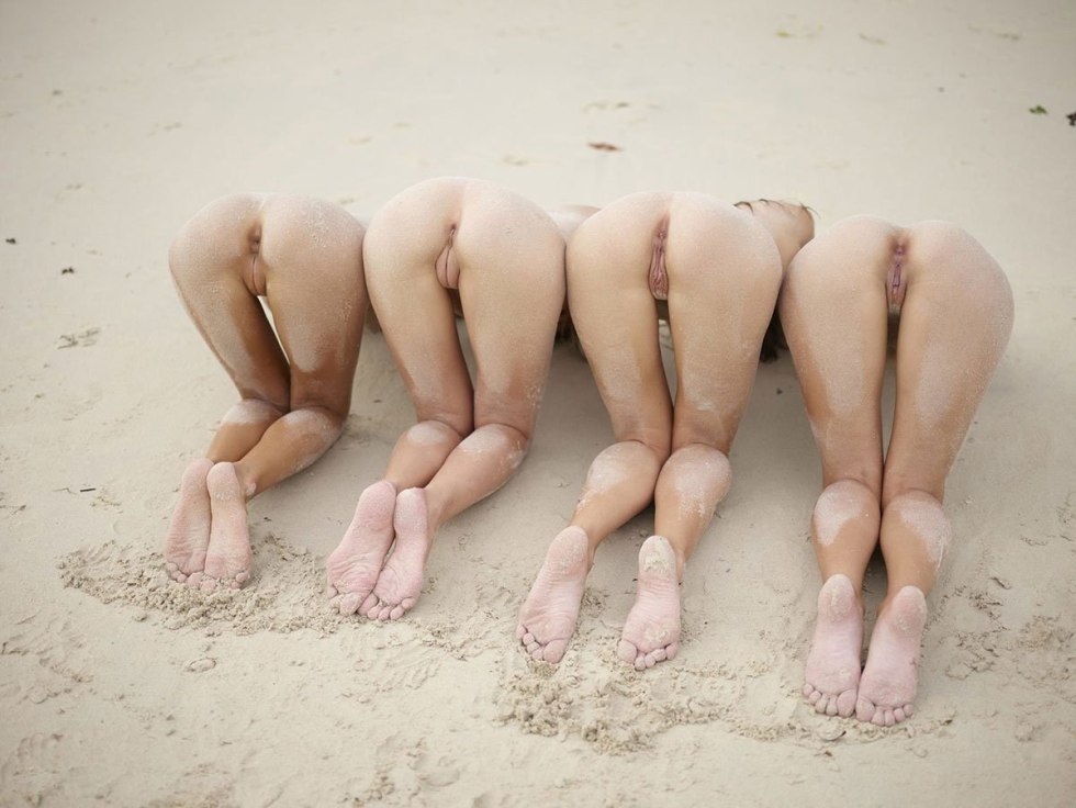 Naked butt in a row on the beach