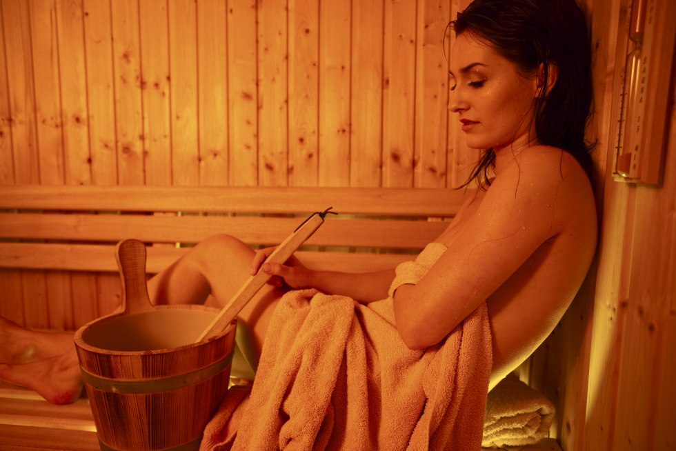 Beautiful brunette in the bathhouse