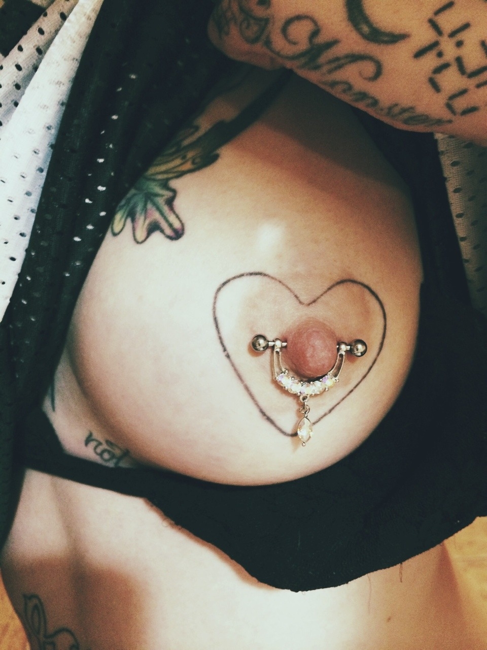 Beautiful female breast with piercing