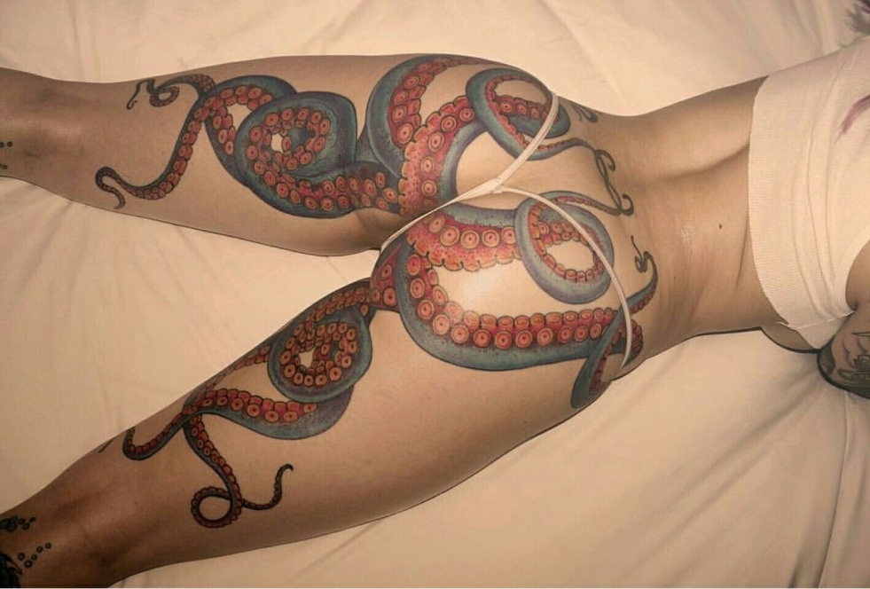 Girl with octopus tattoo on chest