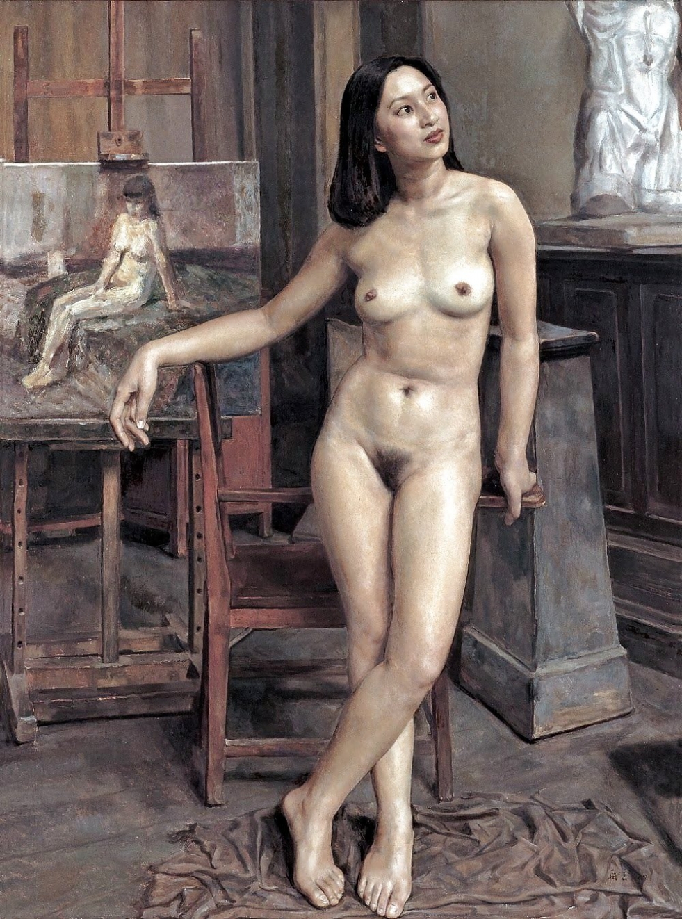 Naked posing sculptor