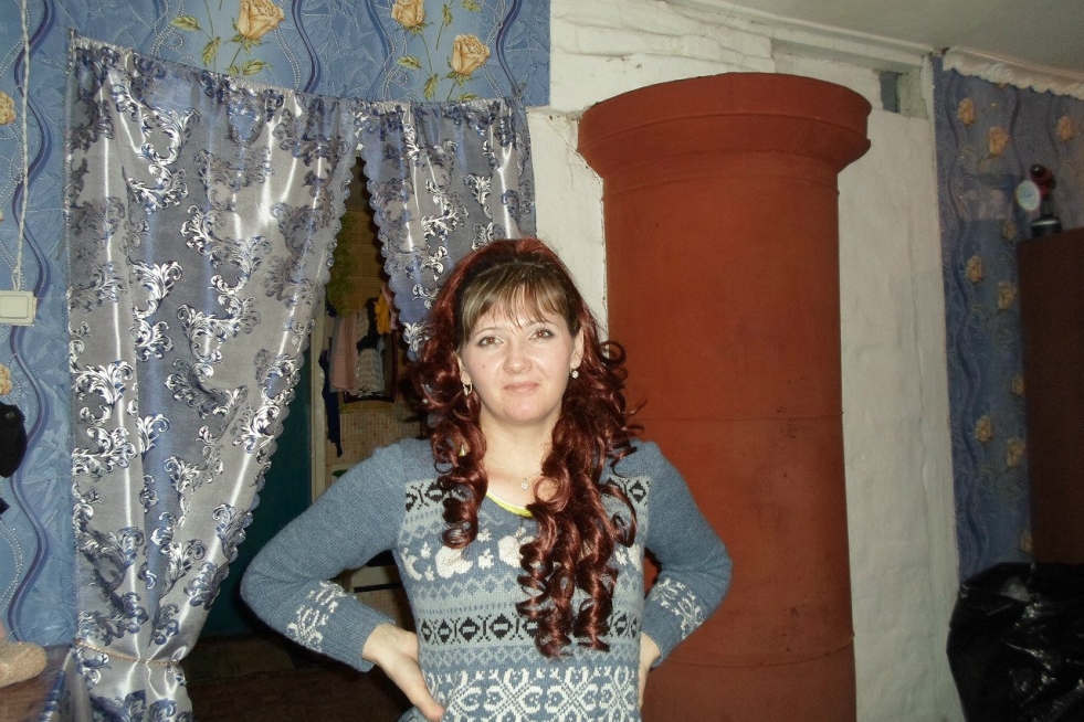 Bare women bathe in a pond