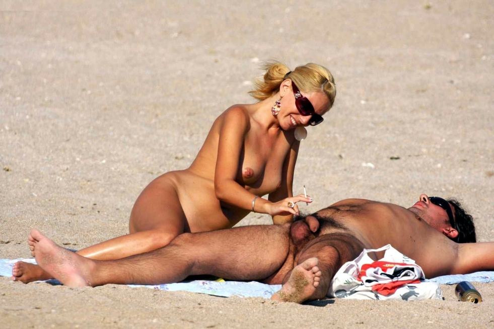 Naked girls with guys on the beach