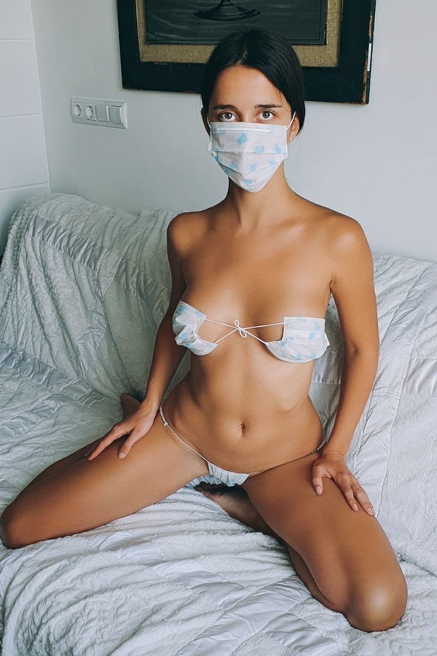 Naked in a medical mask