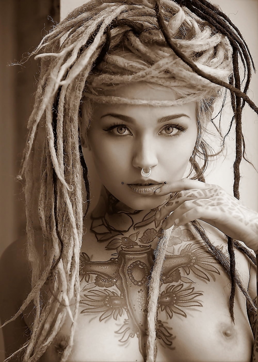 Girl with dreadlocks undressing