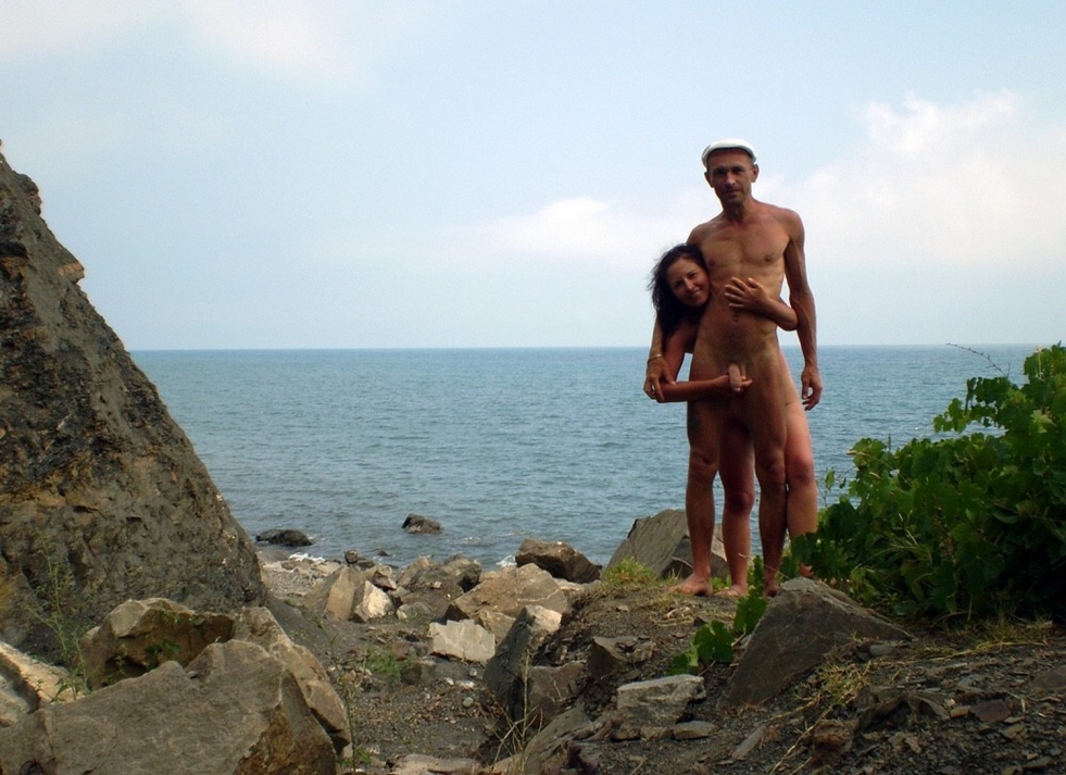 Pretty woman on a stone naked