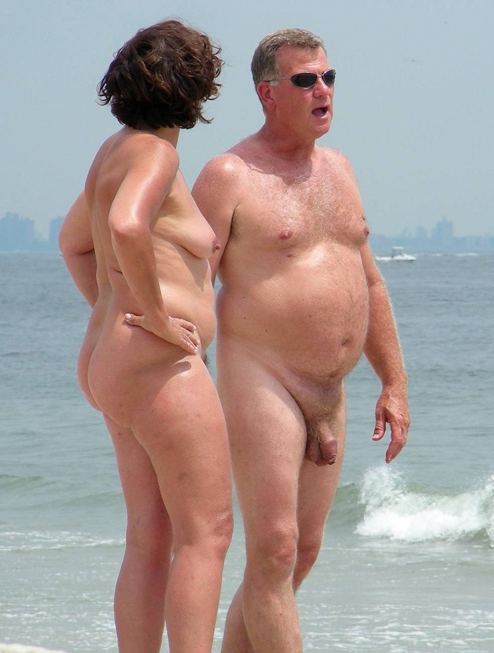 Naked mature couples on the beach