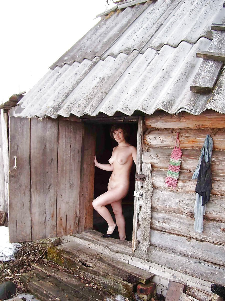 Naked women in a rustic bath