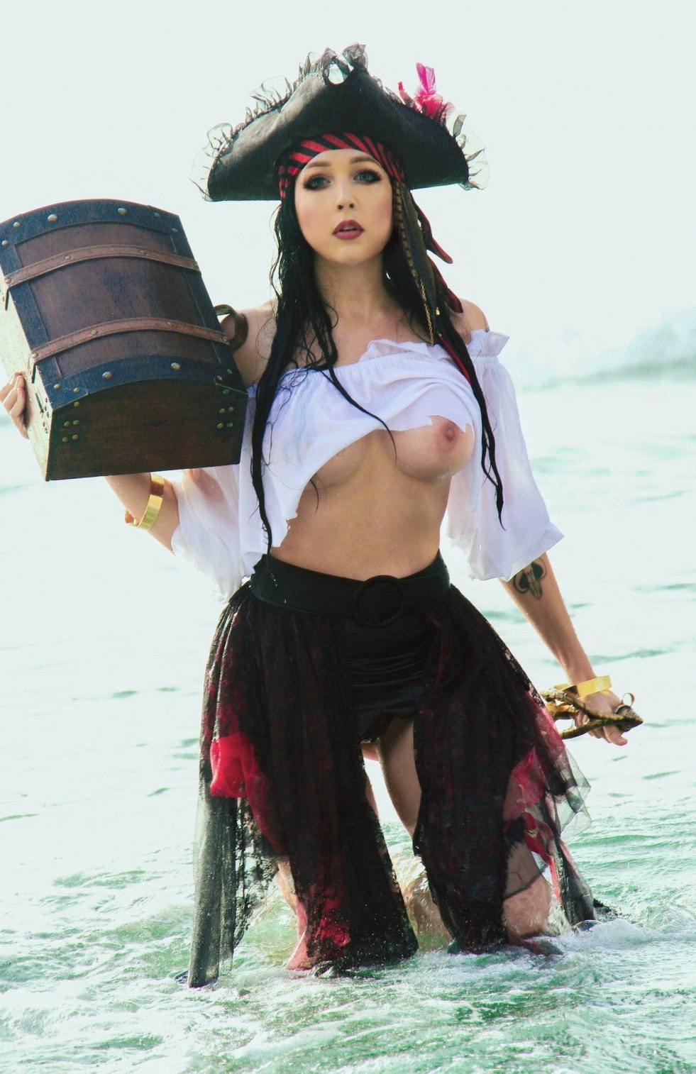 Woman pirate with bare tits