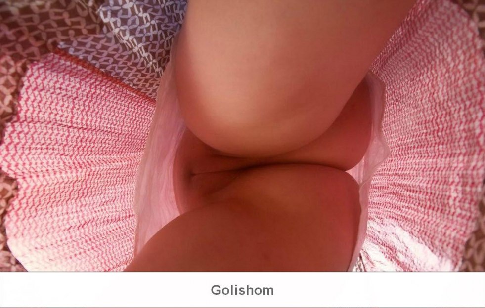 Girl in a dress without panties View from below