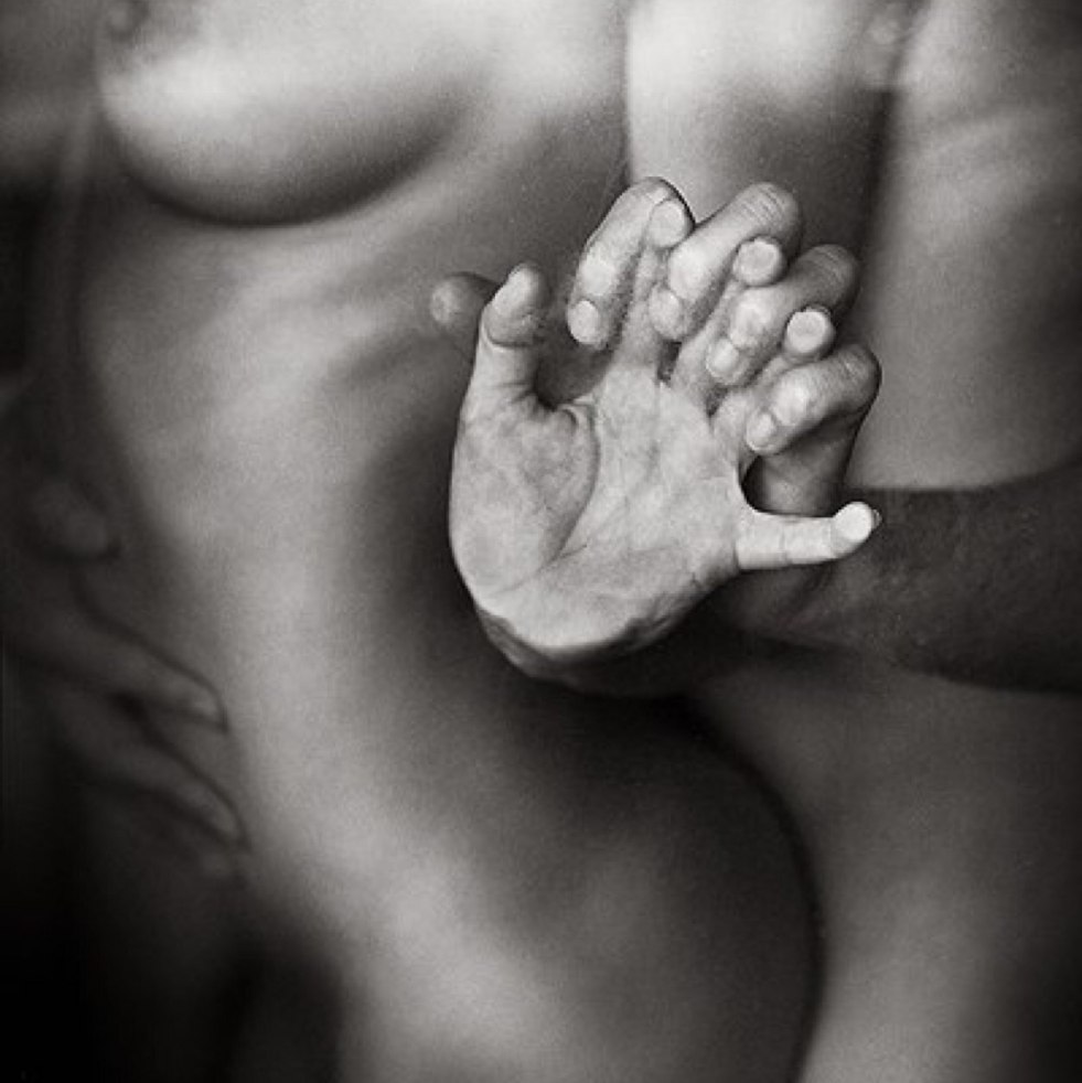 Naked woman on male hands