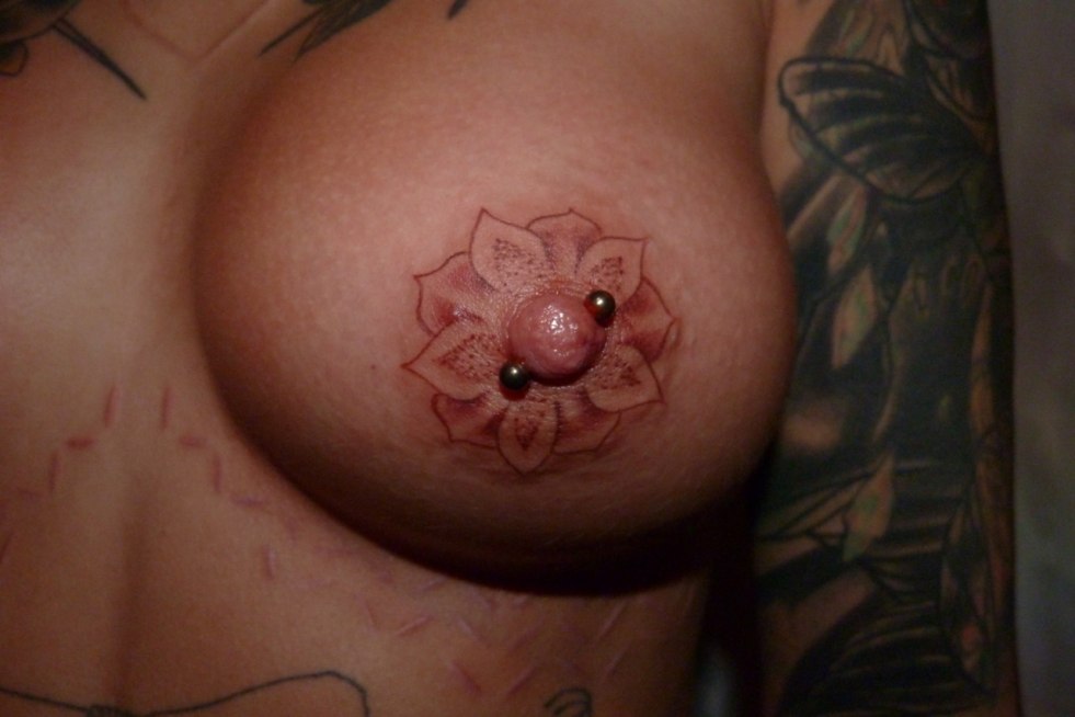 Beautiful tattoo on female nipples