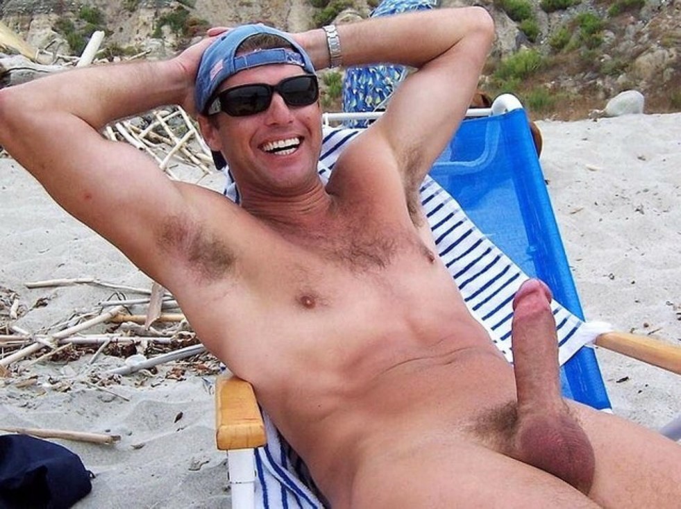 Adult man with a cock on the beach