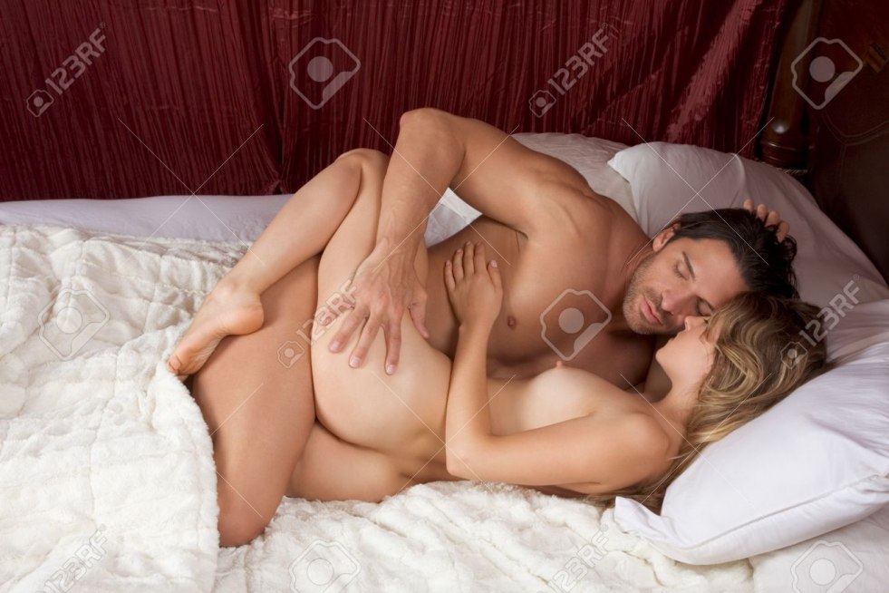 Man and woman naked in bed