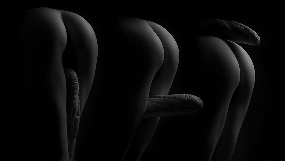 Naked ass on a black background