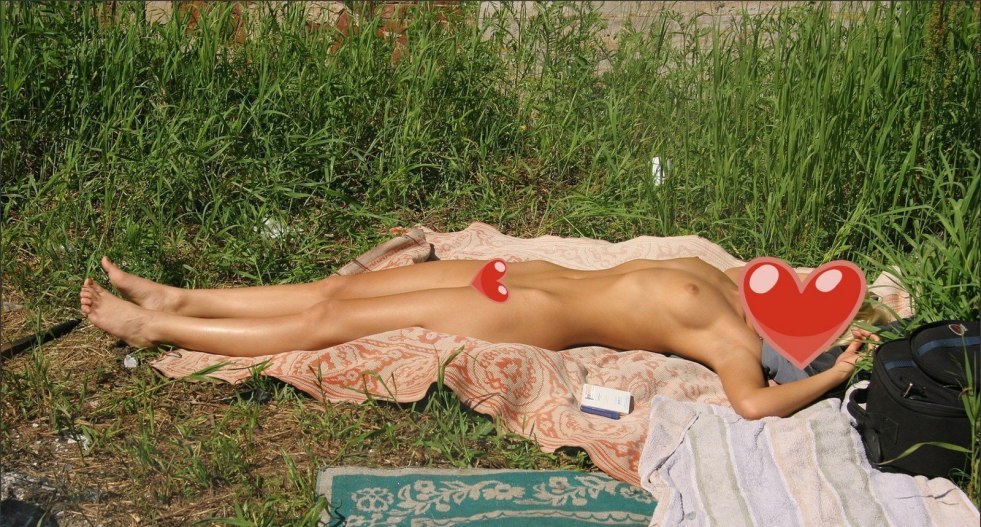 Naked sunbathing in nature