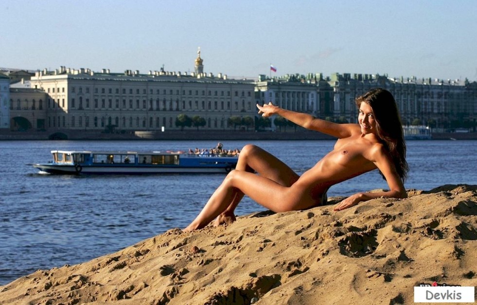 Girl undressed on the waterfront