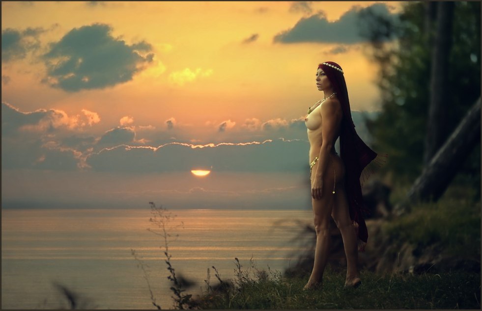 Girls beautiful naked at sunset by water