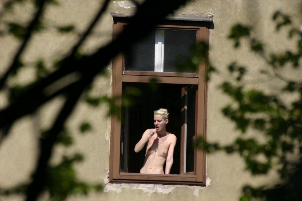 Nude near the panoramic window