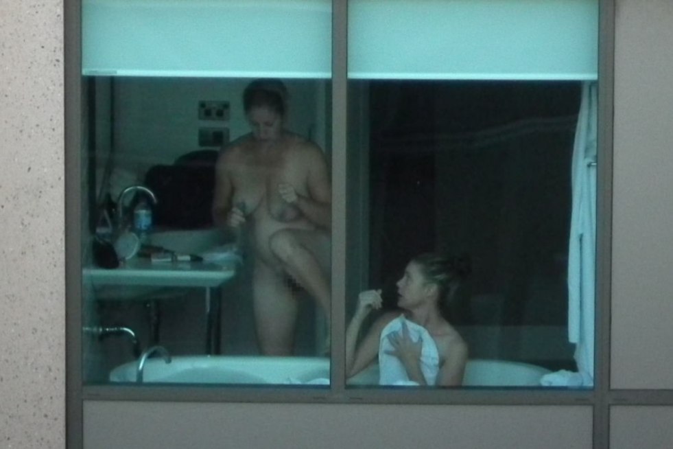 Naked woman in the window opposite